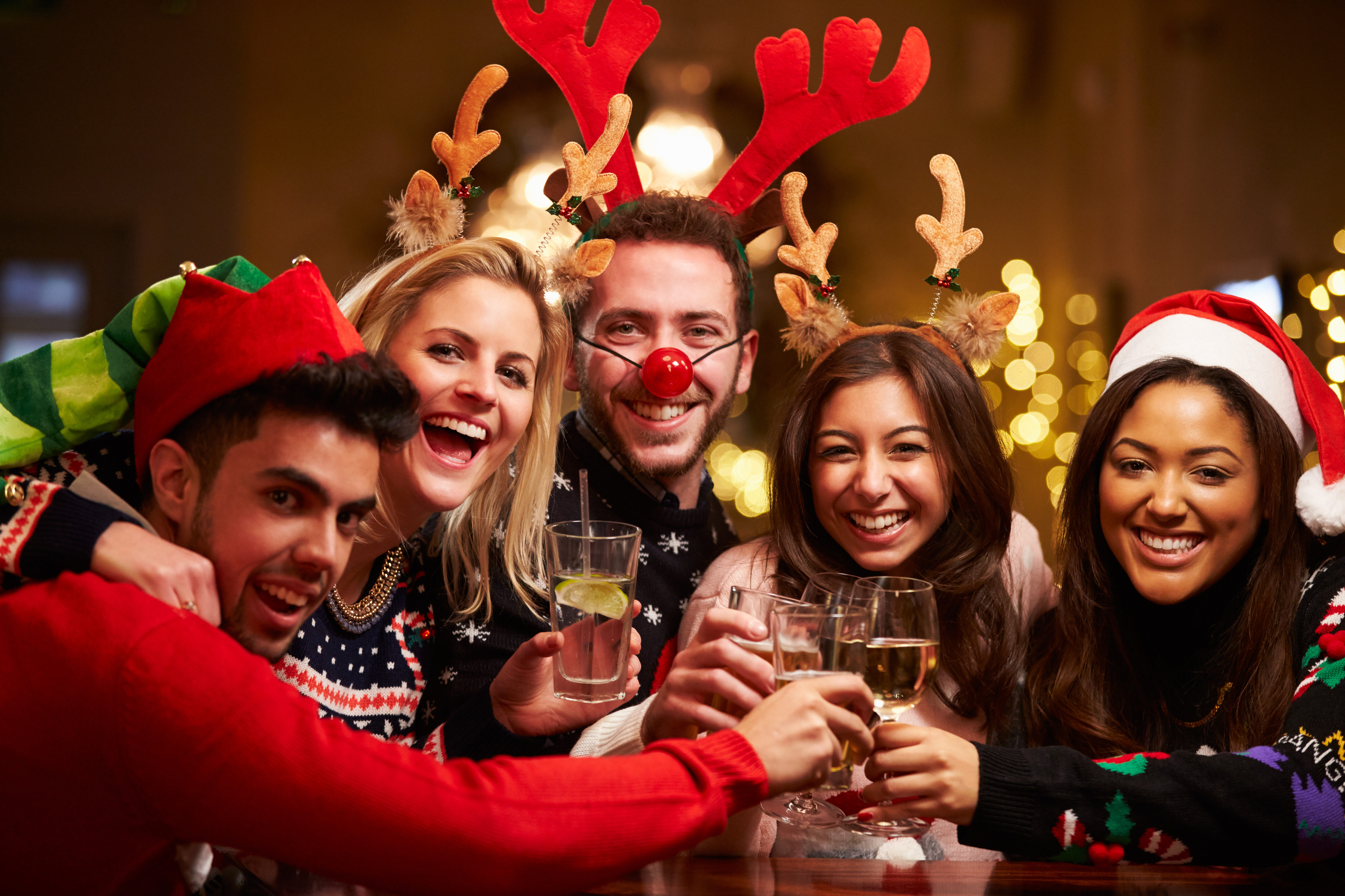 group of friends celebrating christmas at party