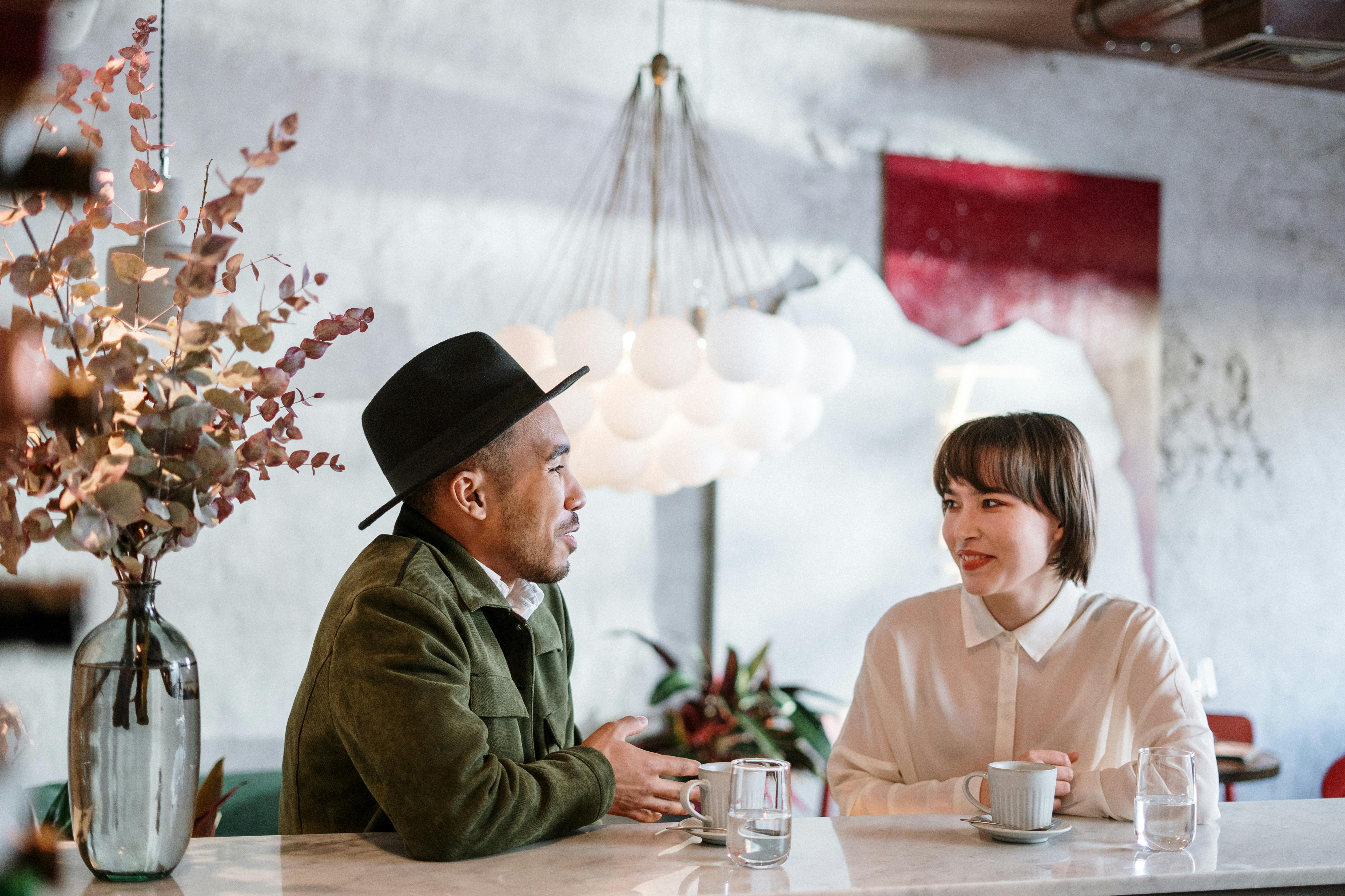 Man and Woman on a date talking at a table