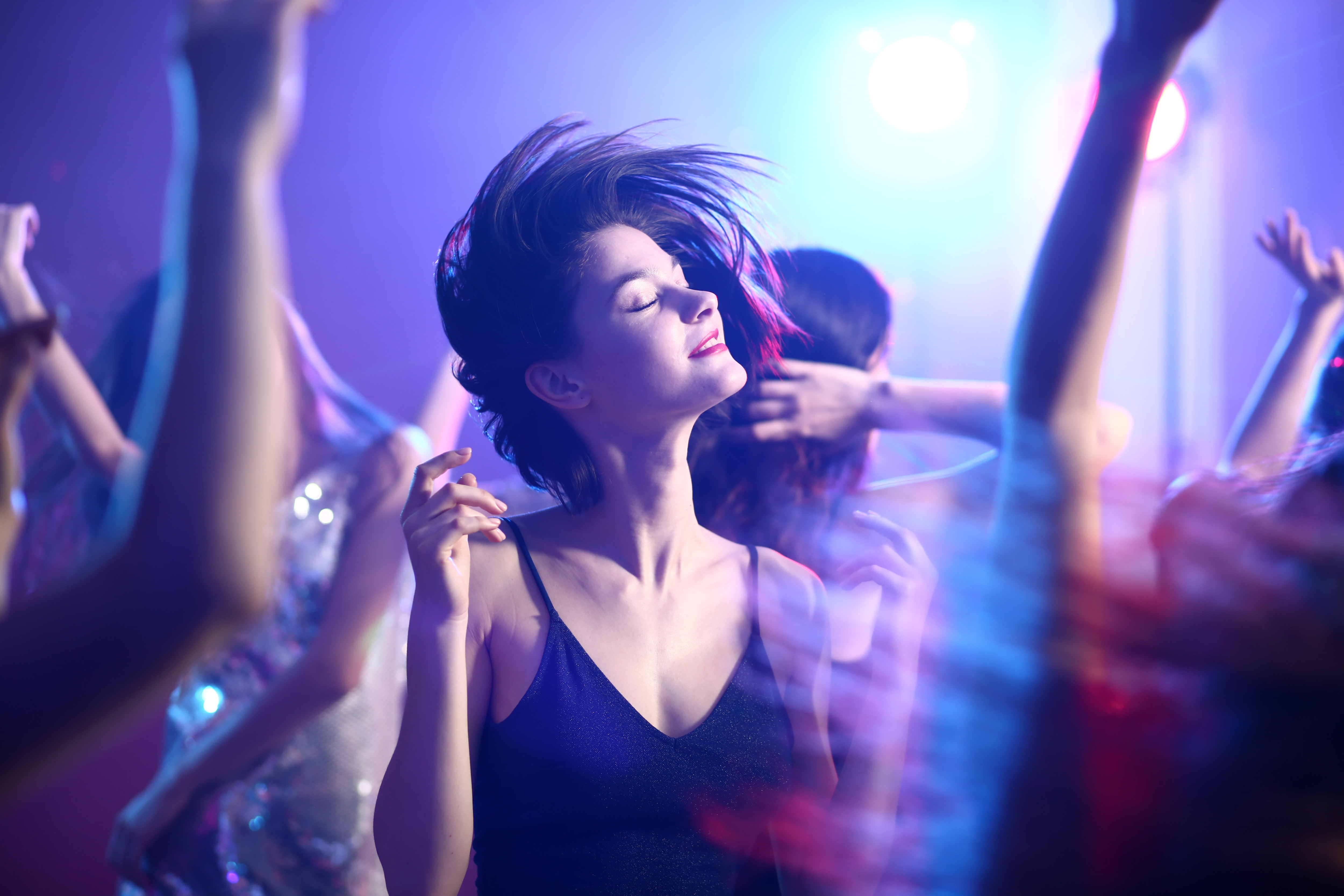 girl dancing in the middle of a party