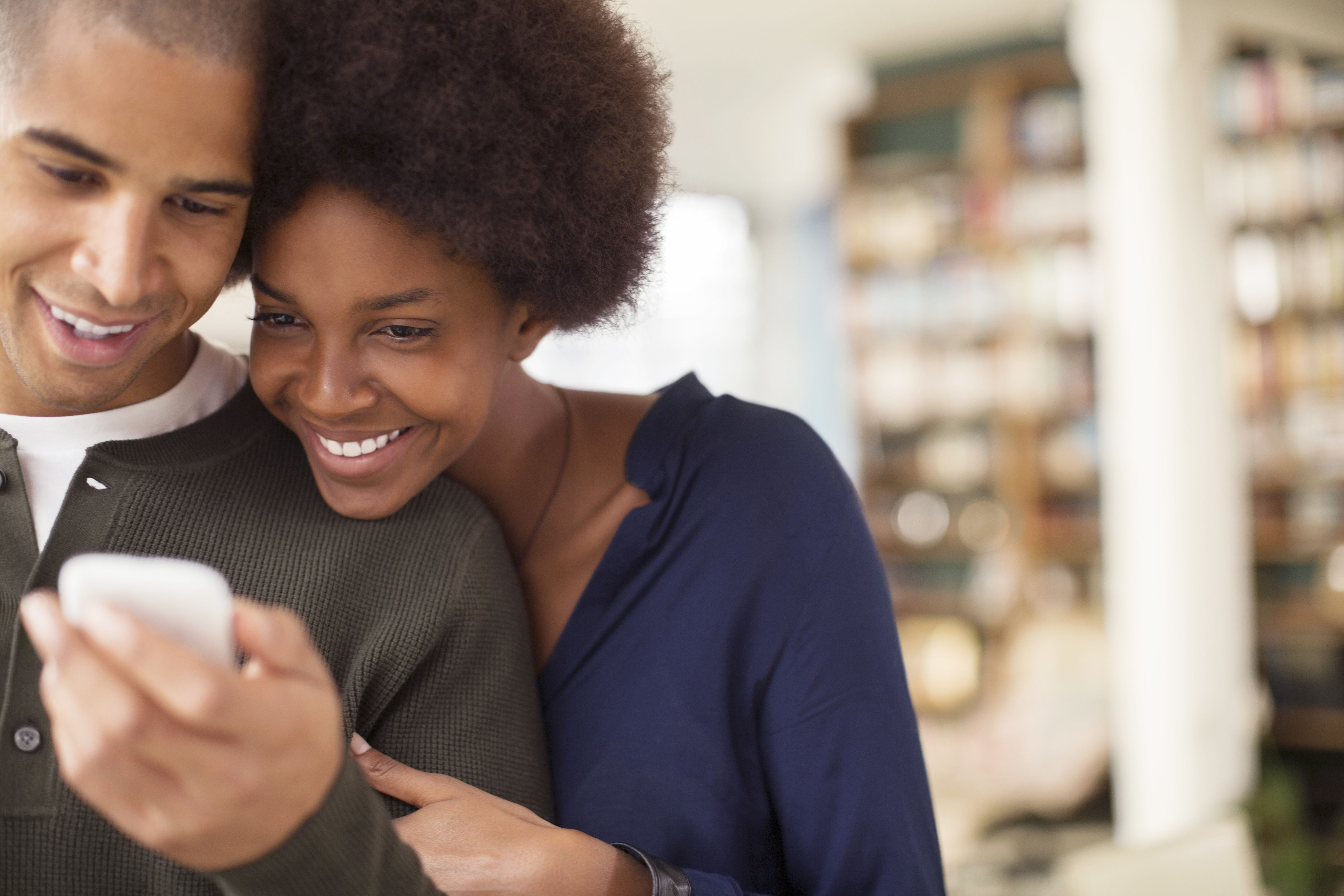 girl and boy looking at phone 