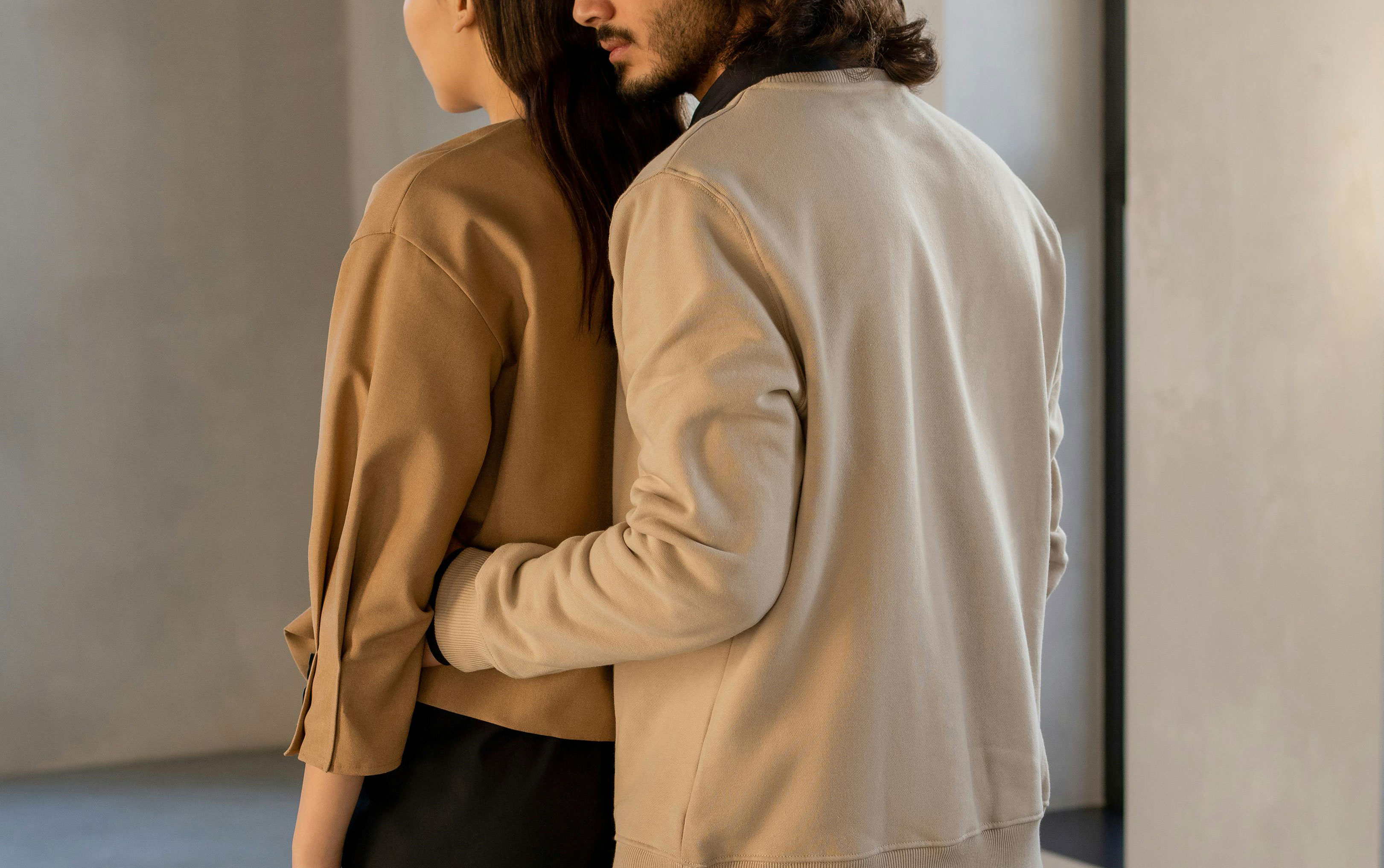 Intertwined hands holding connecting puzzle pieces, symbolizing trust-building exercises for couples in the background.